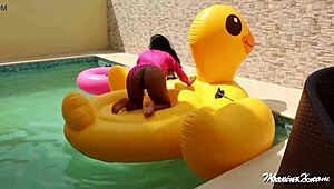 Maxine X teases by the pool, shoving a huge dildo into her squirting slit. What a wild solo show!