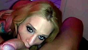 Tattooed pornstar Sarah Jessie performs blowjob in bathroom