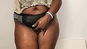 Ebony wife touches herself in shower while clothed