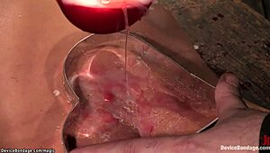 Bound slave intensely waxed and tormented with machines