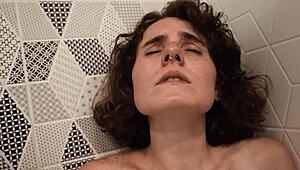 Awesome cam girl SHOWERS in the BATHROOM, teasing her TITS.