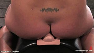 Bound slave intensely waxed and tormented with machines