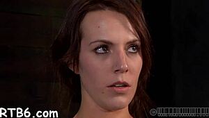 Bound villein endures beaver punishment from lusty femdom goddess in garage