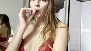 i'm watching melena maria rya strip in hot red lingerie, her shaved pussy on display