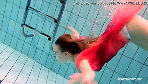 Busty teen Duna Bultihalo seductively swims in red dress