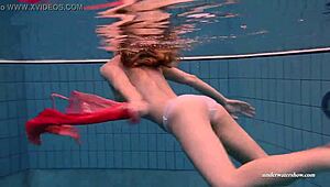 Busty teen Duna Bultihalo seductively swims in red dress