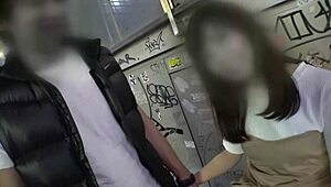 Asian beauty gets toyed by two hands in threesome