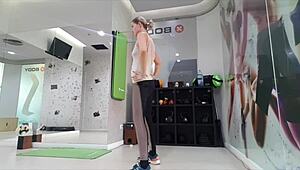 Cute blonde teen warms up at gym