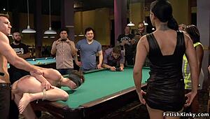 Double penetration for a submissive slut in a public bar