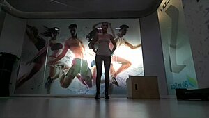 Cute blonde teen warms up at gym