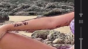 Drawing a hot african woman in bikini on the beach while masturbating