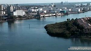 Two pretty girls perform a striptease and get naked in public