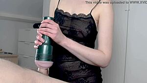 Seductive milf gives a mind-blowing handjob on a large Fleshlight