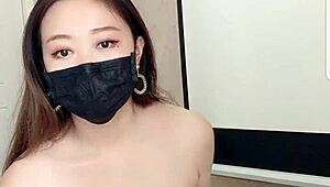 asian babe drinks milk on cam