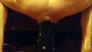 Enjoying a huge black dildo in my ass for intense anal pleasure