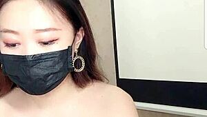 asian babe drinks milk on cam