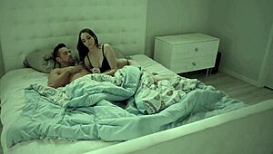 A sultry woman with large breasts wakes up her partner for an intense anal encounter