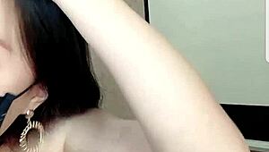 asian babe drinks milk on cam