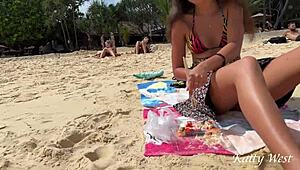Girl eats sushi with no panties on public beach. Flashing upskirt shocks everyone around her.