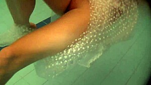 Russian Naked Babe Natalia Swims and Strips in Pool