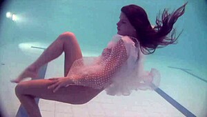 Russian Naked Babe Natalia Swims and Strips in Pool