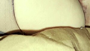 Intimate close-up of oral pleasure in torn pantyhose with nipple stimulation and climax