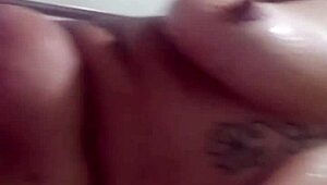 Mature milf masturbates shaved pussy with toys in live phone shower session