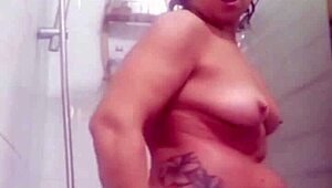 Mature milf masturbates shaved pussy with toys in live phone shower session