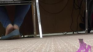 Wife teases with candid shoeplay in nude nylons at library.