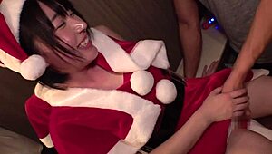 Young Japanese Santa Claus with big natural tits masturbates in the toilet