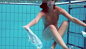 Beautiful Hungarian woman swims in the pool and gets horny.