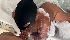 My sister-in-law gave a blowjob in the bathtub, her shaved pussy wet.