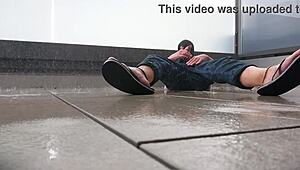 Masked babe jerks off wildly on wet balcony