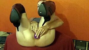 she masturbates solo with anal toy, fingering her ass to orgasm.