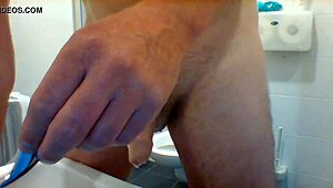 Gay guy urinates while masturbating cock