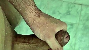 Young bisexual guy masturbates in the shower in this homemade video.