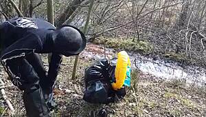 bizarre german femdom with mud and latex outdoors