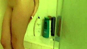 britney blue teases and fingers herself in the shower, stripping slowly as water cascades