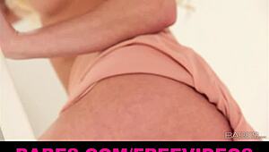 gorgeous blonde bombshell leony april elegantly displays her natural curves.