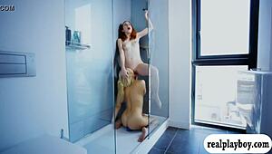 two attractive babes fucking a blue dildo while licking each other passionately