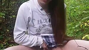 Skinny girl pees outdoors