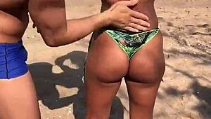 Beach Lesbians Apply Sunscreen in Tiny Bikinis