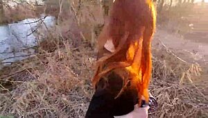Redhaired teen undresses outdoors first time