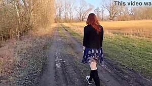 Redhaired teen undresses outdoors first time