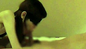 a stunning asian in chinese dress gives epic handjob