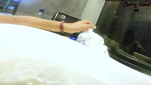 Steamy underwater footjob with nipple play in the bath