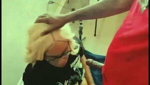 Blonde barbie takes monster black cock deep in her throat and swallows cumshot