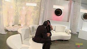 Model With Big Boobs Poses On The White Sofa