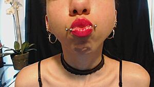 applying hot pink lipstick with drooling effect