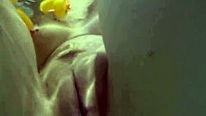 Sexy blonde pornstar nadia masturbates in bath with rubber duckies